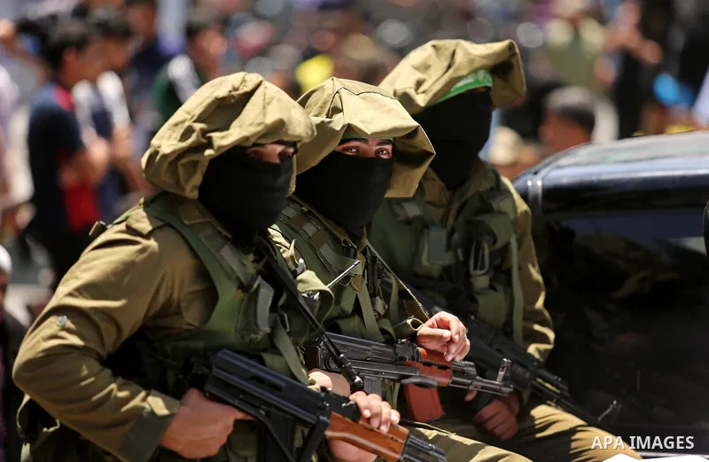Members of the Ezzedine al-Qassam Brigades, the military wing of the Palestinian Islamist movement Hamas, attend the funeral of their comrade Ibrahim Abu Al-Naja in Rafah, southern Gaza Strip June 8, 2017. Photo by Ashra...