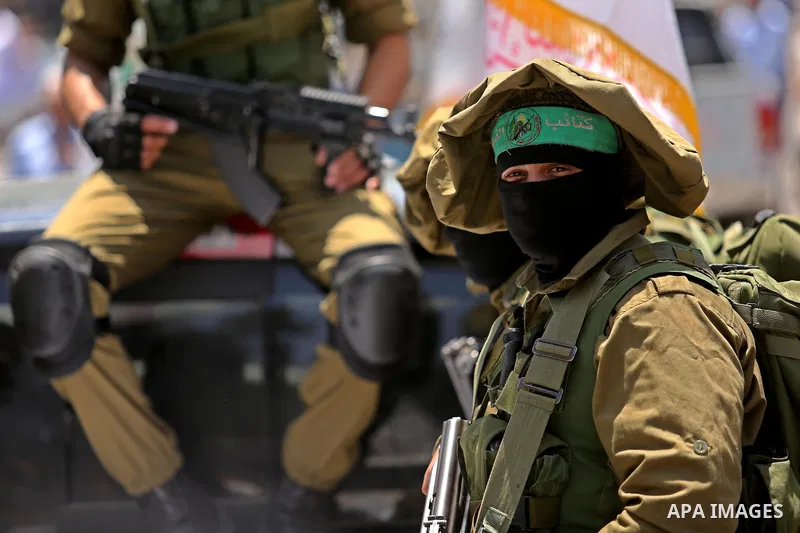 Members of the Ezzedine al-Qassam Brigades, the military wing of the Palestinian Islamist movement Hamas, attend the funeral of their comrade Ibrahim Abu Al-Naja in Rafah, southern Gaza Strip June 8, 2017. Photo by Ashra...
