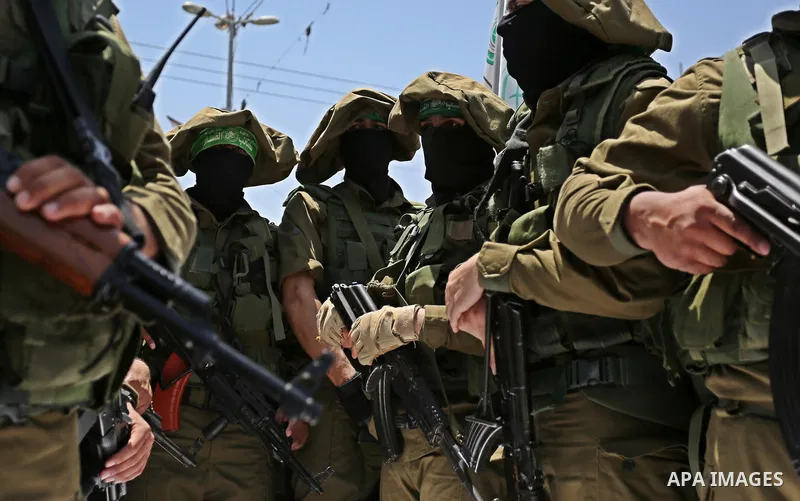Members of the Ezzedine al-Qassam Brigades, the military wing of the Palestinian Islamist movement Hamas, attend the funeral of their comrade Ibrahim Abu Al-Naja in Rafah, southern Gaza Strip June 8, 2017. Photo by Ashra...
