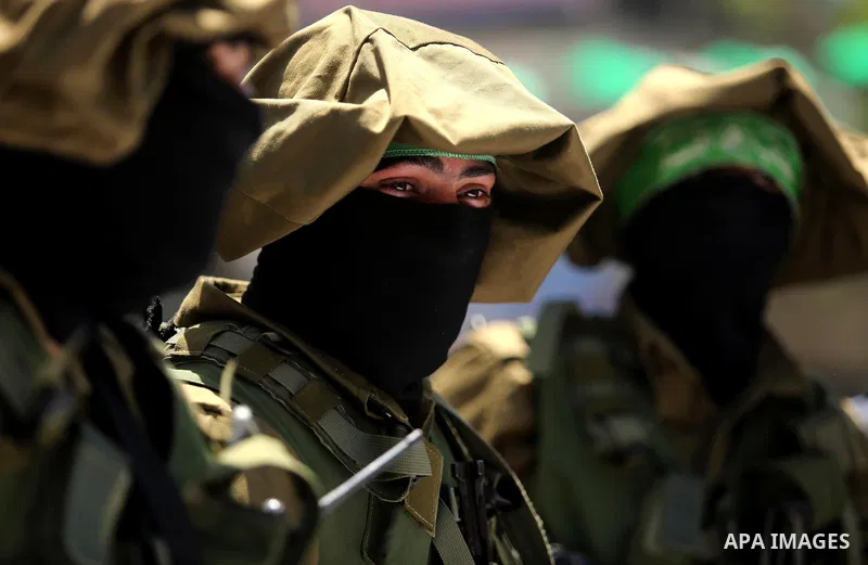 Members of the Ezzedine al-Qassam Brigades, the military wing of the Palestinian Islamist movement Hamas, attend the funeral of their comrade Ibrahim Abu Al-Naja in Rafah, southern Gaza Strip June 8, 2017. Photo by Ashra...