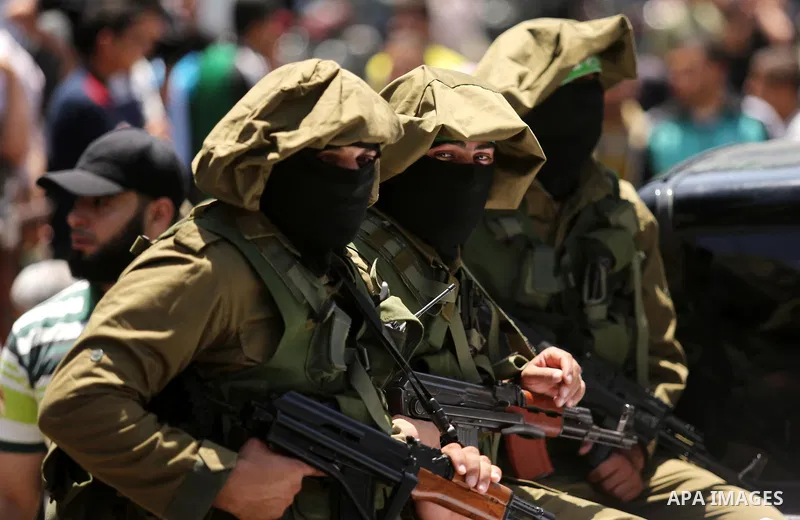 Members of the Ezzedine al-Qassam Brigades, the military wing of the Palestinian Islamist movement Hamas, attend the funeral of their comrade Ibrahim Abu Al-Naja in Rafah, southern Gaza Strip June 8, 2017. Photo by Ashra...