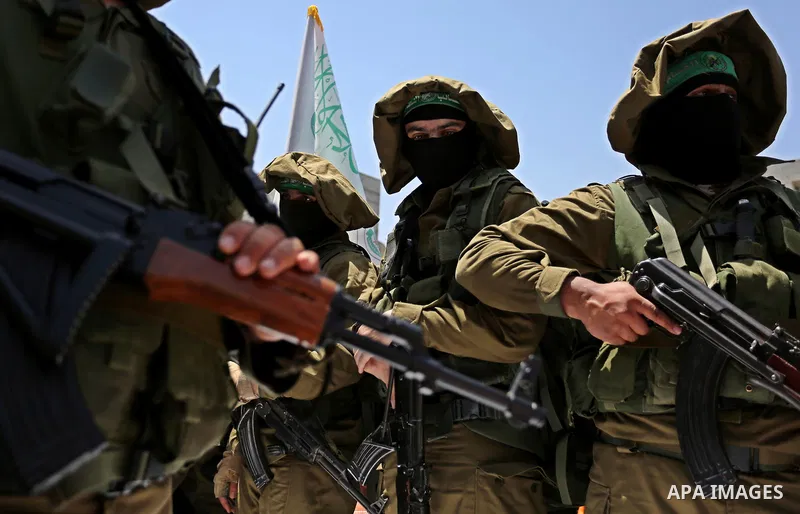 Members of the Ezzedine al-Qassam Brigades, the military wing of the Palestinian Islamist movement Hamas, attend the funeral of their comrade Ibrahim Abu Al-Naja in Rafah, southern Gaza Strip June 8, 2017. Photo by Ashra...