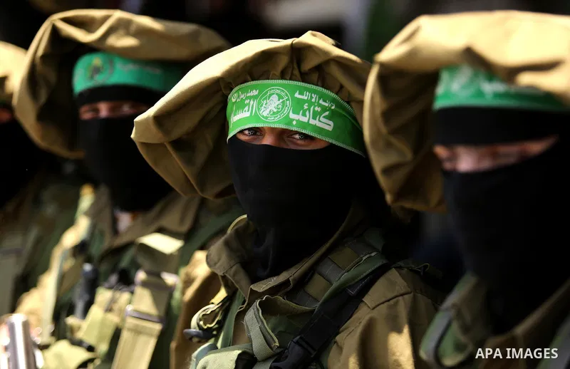 Members of the Ezzedine al-Qassam Brigades, the military wing of the Palestinian Islamist movement Hamas, attend the funeral of their comrade Ibrahim Abu Al-Naja in Rafah, southern Gaza Strip June 8, 2017. Photo by Ashra...
