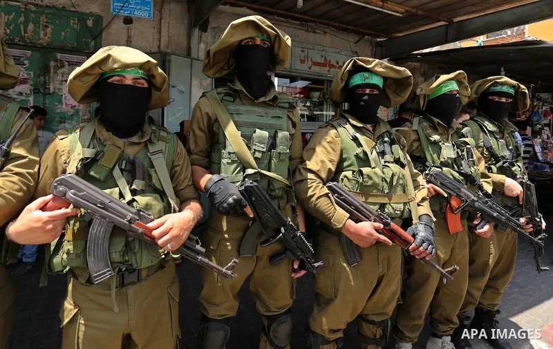 Members of the Ezzedine al-Qassam Brigades, the military wing of the Palestinian Islamist movement Hamas, attend the funeral of their comrade Ibrahim Abu Al-Naja in Rafah, southern Gaza Strip June 8, 2017. Photo by Ashra...