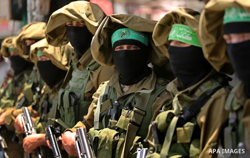 Members of the Ezzedine al-Qassam Brigades, the military wing of the Palestinian Islamist movement Hamas, attend the funeral of their comrade Ibrahim Abu Al-Naja in Rafah, southern Gaza Strip June 8, 2017. Photo by Ashra...