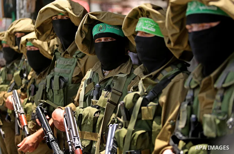 Members of the Ezzedine al-Qassam Brigades, the military wing of the Palestinian Islamist movement Hamas, attend the funeral of their comrade Ibrahim Abu Al-Naja in Rafah, southern Gaza Strip June 8, 2017. Photo by Ashra...
