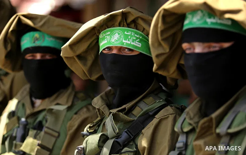 Members of the Ezzedine al-Qassam Brigades, the military wing of the Palestinian Islamist movement Hamas, attend the funeral of their comrade Ibrahim Abu Al-Naja in Rafah, southern Gaza Strip June 8, 2017. Photo by Ashra...