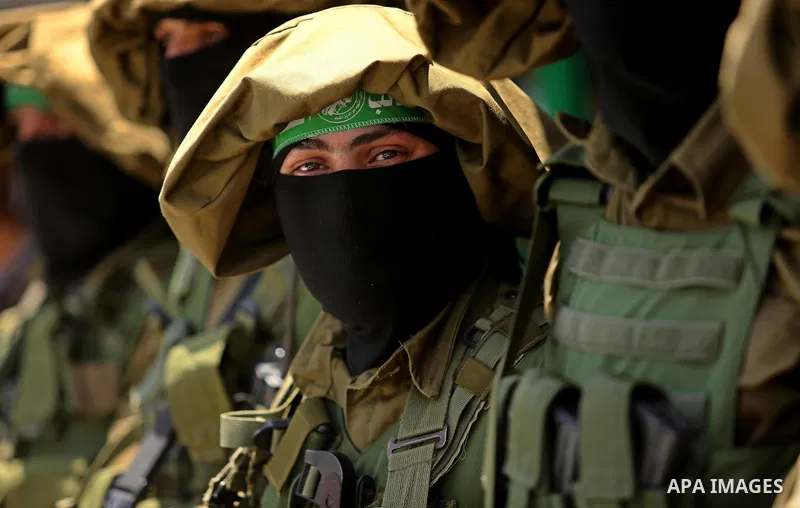 Members of the Ezzedine al-Qassam Brigades, the military wing of the Palestinian Islamist movement Hamas, attend the funeral of their comrade Ibrahim Abu Al-Naja in Rafah, southern Gaza Strip June 8, 2017. Photo by Ashra...