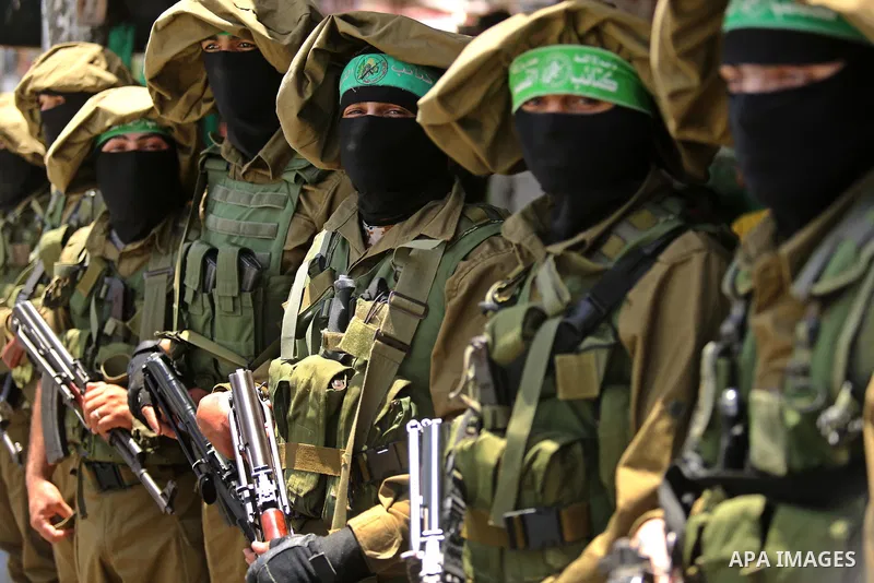 Members of the Ezzedine al-Qassam Brigades, the military wing of the Palestinian Islamist movement Hamas, attend the funeral of their comrade Ibrahim Abu Al-Naja in Rafah, southern Gaza Strip June 8, 2017. Photo by Ashra...