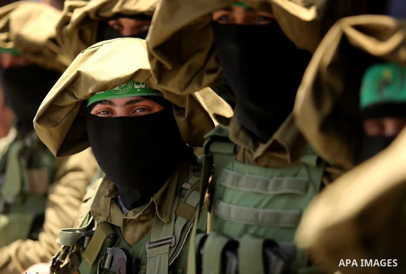 Members of the Ezzedine al-Qassam Brigades, the military wing of the Palestinian Islamist movement Hamas, attend the funeral of their comrade Ibrahim Abu Al-Naja in Rafah, southern Gaza Strip June 8, 2017. Photo by Ashra...