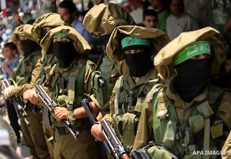 Members of the Ezzedine al-Qassam Brigades, the military wing of the Palestinian Islamist movement Hamas, attend the funeral of their comrade Ibrahim Abu Al-Naja in Rafah, southern Gaza Strip June 8, 2017. Photo by Ashra...