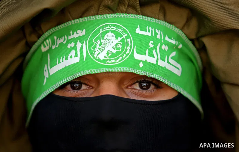 A Member of the Ezzedine al-Qassam Brigades, the military wing of the Palestinian Islamist movement Hamas, attends the funeral of his comrade Ibrahim Abu Al-Naja in Rafah, southern Gaza Strip June 8, 2017. Photo by Ashra...