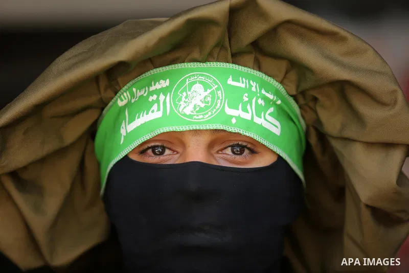 A Member of the Ezzedine al-Qassam Brigades, the military wing of the Palestinian Islamist movement Hamas, attends the funeral of his comrade Ibrahim Abu Al-Naja in Rafah, southern Gaza Strip June 8, 2017. Photo by Ashra...