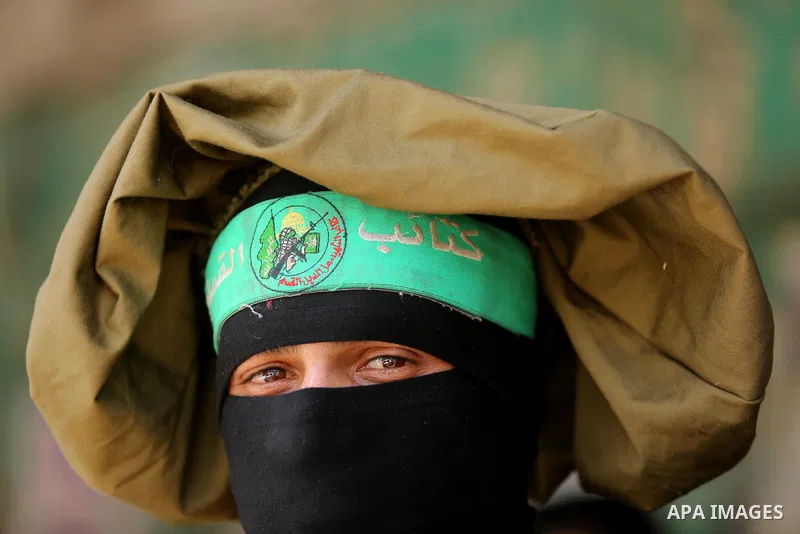 A Member of the Ezzedine al-Qassam Brigades, the military wing of the Palestinian Islamist movement Hamas, attends the funeral of his comrade Ibrahim Abu Al-Naja in Rafah, southern Gaza Strip June 8, 2017. Photo by Ashra...