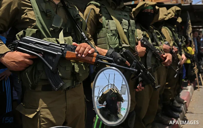 Members of the Ezzedine al-Qassam Brigades, the military wing of the Palestinian Islamist movement Hamas, attend the funeral of their comrade Ibrahim Abu Al-Naja in Rafah, southern Gaza Strip June 8, 2017. Photo by Ashra...