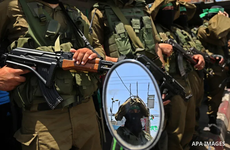Members of the Ezzedine al-Qassam Brigades, the military wing of the Palestinian Islamist movement Hamas, attend the funeral of their comrade Ibrahim Abu Al-Naja in Rafah, southern Gaza Strip June 8, 2017. Photo by Ashra...