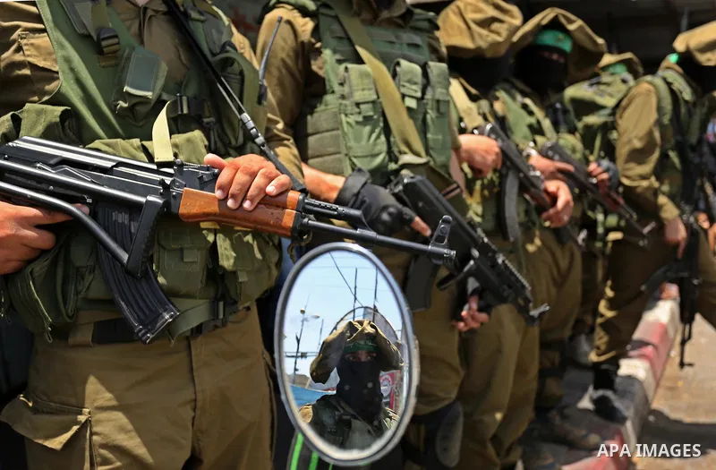 Members of the Ezzedine al-Qassam Brigades, the military wing of the Palestinian Islamist movement Hamas, attend the funeral of their comrade Ibrahim Abu Al-Naja in Rafah, southern Gaza Strip June 8, 2017. Photo by Ashra...