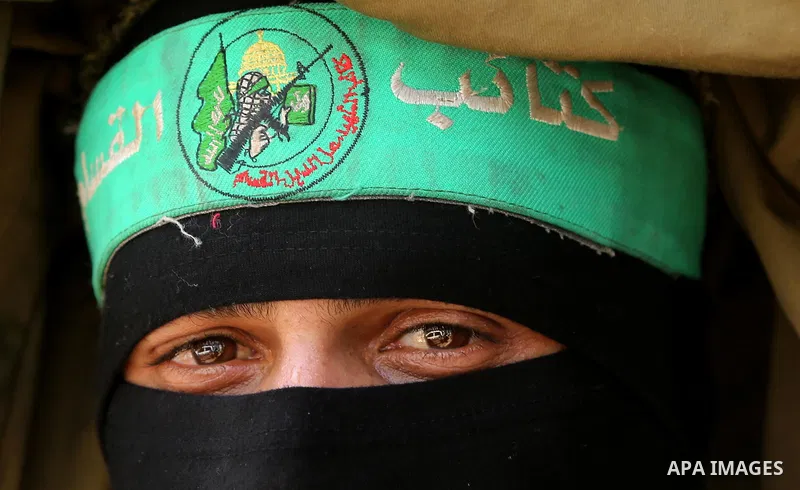 A Member of the Ezzedine al-Qassam Brigades, the military wing of the Palestinian Islamist movement Hamas, attends the funeral of his comrade Ibrahim Abu Al-Naja in Rafah, southern Gaza Strip June 8, 2017. Photo by Ashra...