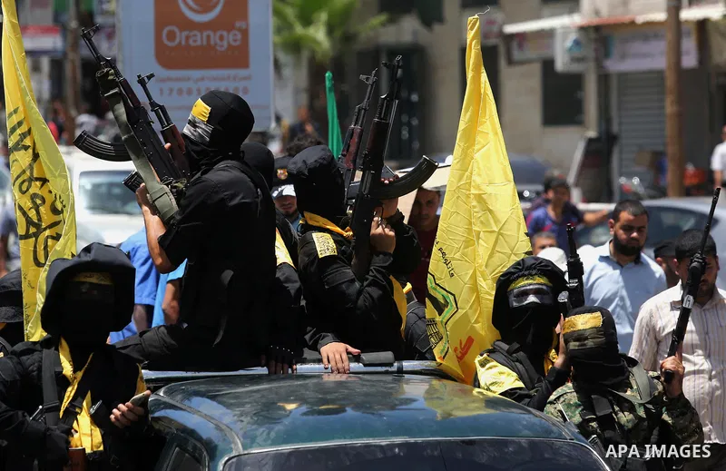 Members of the Ezzedine al-Qassam Brigades, the military wing of the Palestinian Islamist movement Hamas, attend the funeral of their comrade Ibrahim Abu Al-Naja in Rafah, southern Gaza Strip June 8, 2017. Photo by Ashra...