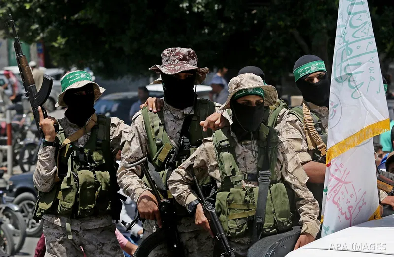 Members of the Ezzedine al-Qassam Brigades, the military wing of the Palestinian Islamist movement Hamas, attend the funeral of their comrade Ibrahim Abu Al-Naja in Rafah, southern Gaza Strip June 8, 2017. Photo by Ashra...