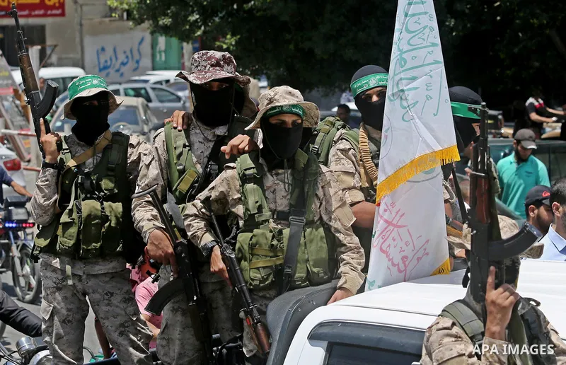 Members of the Ezzedine al-Qassam Brigades, the military wing of the Palestinian Islamist movement Hamas, attend the funeral of their comrade Ibrahim Abu Al-Naja in Rafah, southern Gaza Strip June 8, 2017. Photo by Ashra...