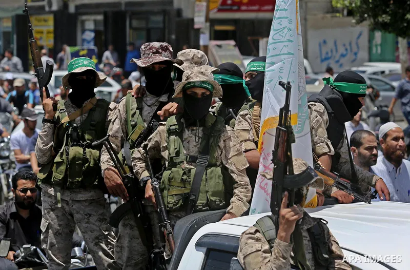 Members of the Ezzedine al-Qassam Brigades, the military wing of the Palestinian Islamist movement Hamas, attend the funeral of their comrade Ibrahim Abu Al-Naja in Rafah, southern Gaza Strip June 8, 2017. Photo by Ashra...