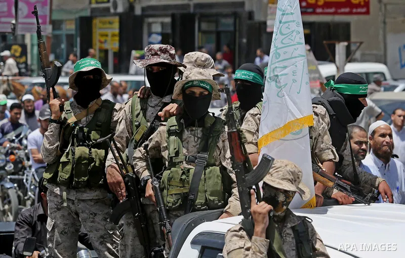 Members of the Ezzedine al-Qassam Brigades, the military wing of the Palestinian Islamist movement Hamas, attend the funeral of their comrade Ibrahim Abu Al-Naja in Rafah, southern Gaza Strip June 8, 2017. Photo by Ashra...