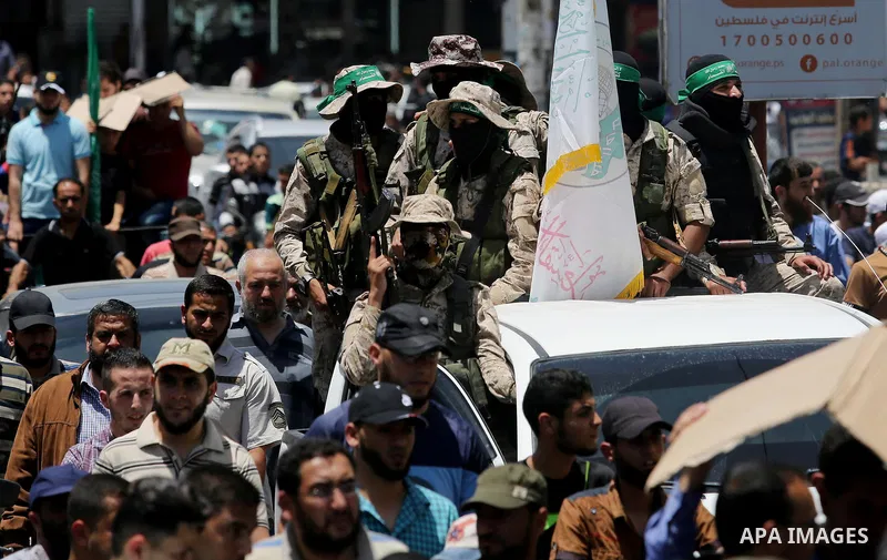 Members of the Ezzedine al-Qassam Brigades, the military wing of the Palestinian Islamist movement Hamas, attend the funeral of their comrade Ibrahim Abu Al-Naja in Rafah, southern Gaza Strip June 8, 2017. Photo by Ashra...