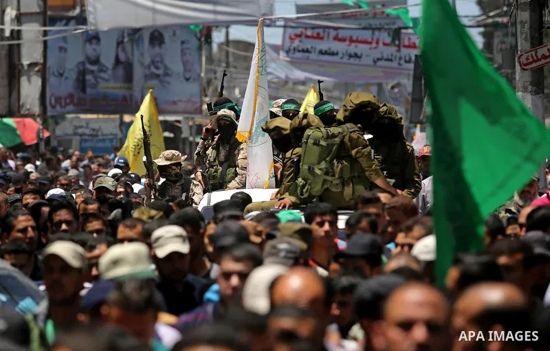 Palestinians attend the funeral of a member the Ezzedine al-Qassam Brigades, the military wing of the Palestinian Islamist movement Hamas of Ibrahim Abu Al-Naja, in Rafah, southern Gaza Strip June 8, 2017. Photo by Ashra...