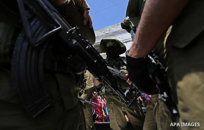 Members of the Ezzedine al-Qassam Brigades, the military wing of the Palestinian Islamist movement Hamas, attend the funeral of their comrade Ibrahim Abu Al-Naja in Rafah, southern Gaza Strip June 8, 2017. Photo by Ashra...