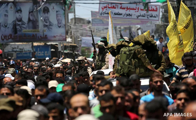 Palestinians attend the funeral of a member the Ezzedine al-Qassam Brigades, the military wing of the Palestinian Islamist movement Hamas of Ibrahim Abu Al-Naja, in Rafah, southern Gaza Strip June 8, 2017. Photo by Ashra...