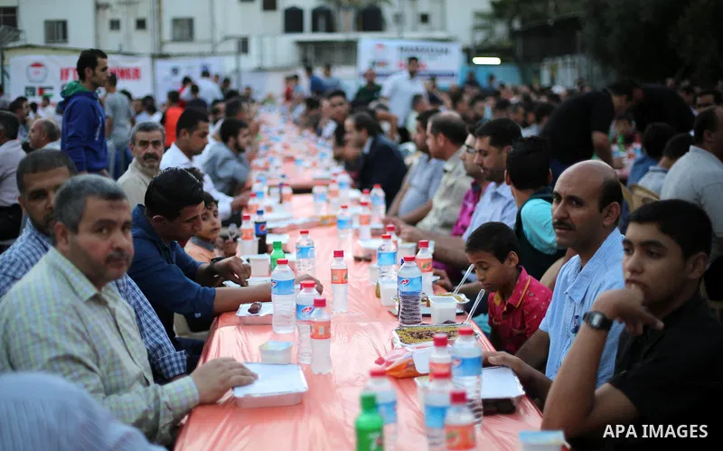 Palestinian Muslims eat their Iftar meal as they break their fast during the holy fasting month of Ramadan, in Gaza city on June 8, 2017. Ramadan is sacred to Muslims because it is during that month that tradition says t...