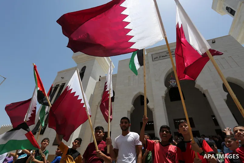 Palestinians take part in a rally in support of Qatar, inside Qatari-funded construction project 'Hamad City', in Khan Younis in the southern Gaza Strip, June 9, 2017. Photo by Ashraf Amra