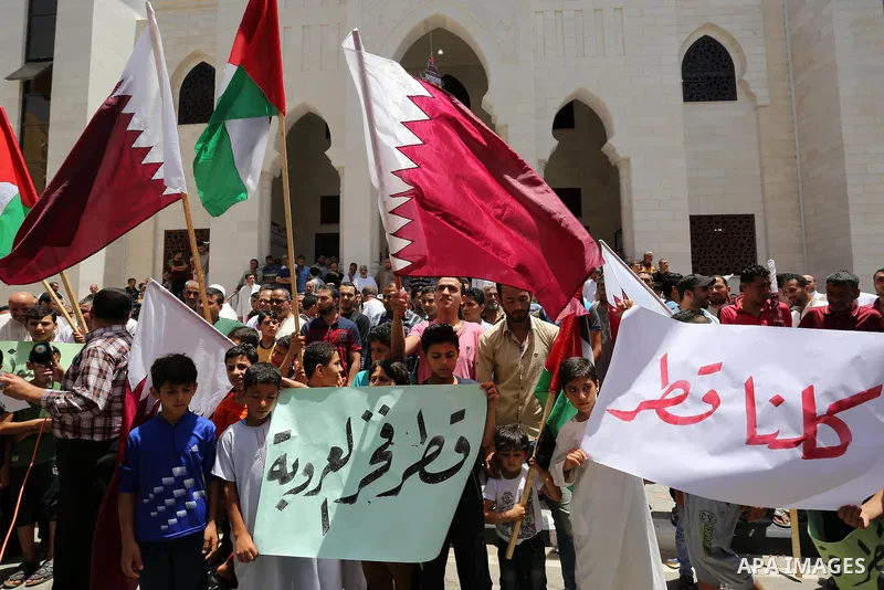 Palestinians take part in a rally in support of Qatar, inside Qatari-funded construction project 'Hamad City', in Khan Younis in the southern Gaza Strip, June 9, 2017. Photo by Ashraf Amra