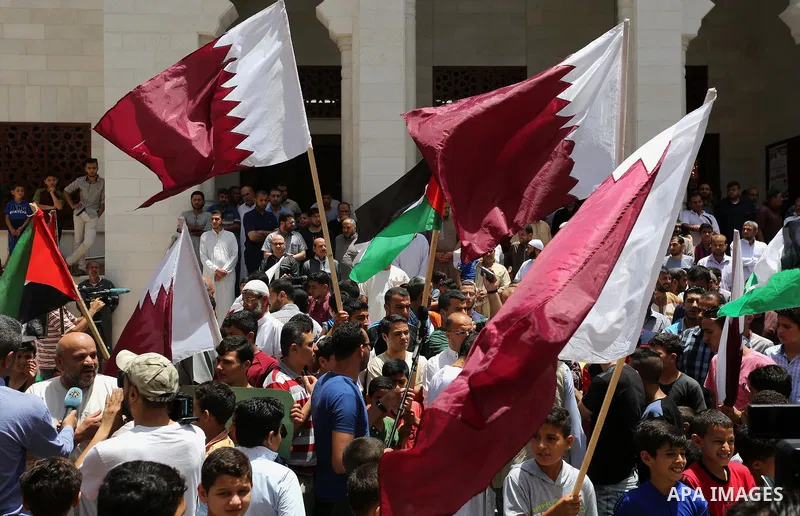Palestinians take part in a rally in support of Qatar, inside Qatari-funded construction project 'Hamad City', in Khan Younis in the southern Gaza Strip, June 9, 2017. Photo by Ashraf Amra