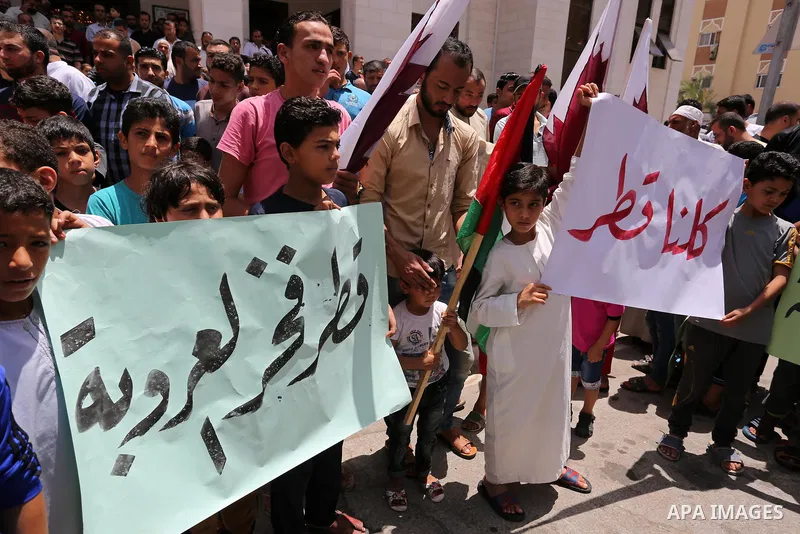Palestinians take part in a rally in support of Qatar, inside Qatari-funded construction project 'Hamad City', in Khan Younis in the southern Gaza Strip, June 9, 2017. Photo by Ashraf Amra
