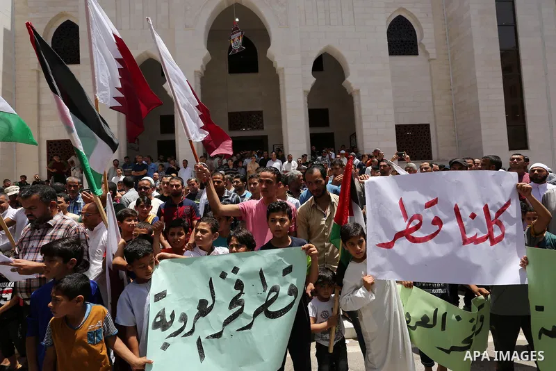 Palestinians take part in a rally in support of Qatar, inside Qatari-funded construction project 'Hamad City', in Khan Younis in the southern Gaza Strip, June 9, 2017. Photo by Ashraf Amra