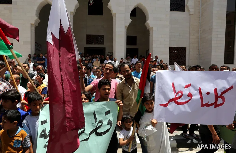 Palestinians take part in a rally in support of Qatar, inside Qatari-funded construction project 'Hamad City', in Khan Younis in the southern Gaza Strip, June 9, 2017. Photo by Ashraf Amra