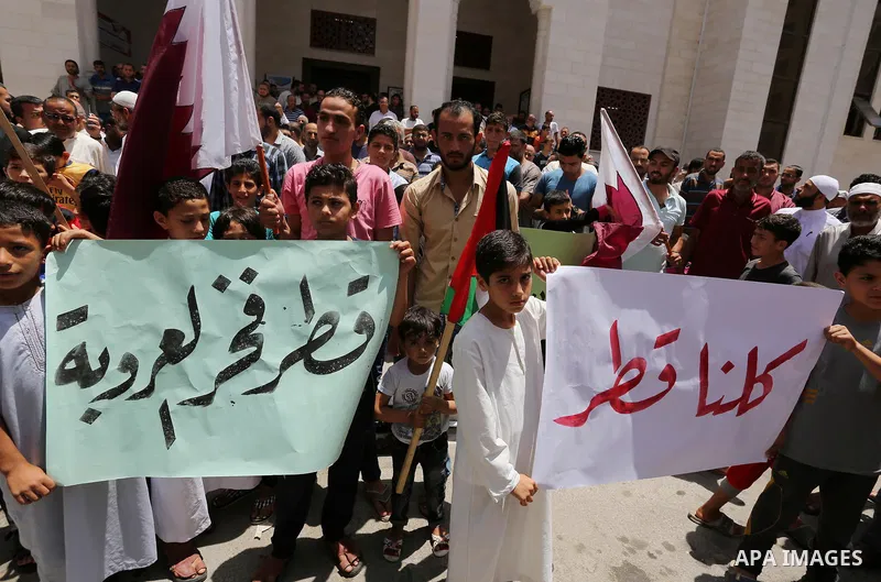 Palestinians take part in a rally in support of Qatar, inside Qatari-funded construction project 'Hamad City', in Khan Younis in the southern Gaza Strip, June 9, 2017. Photo by Ashraf Amra