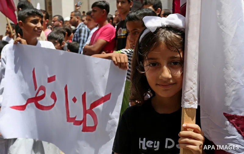 Palestinians take part in a rally in support of Qatar, inside Qatari-funded construction project 'Hamad City', in Khan Younis in the southern Gaza Strip, June 9, 2017. Photo by Ashraf Amra