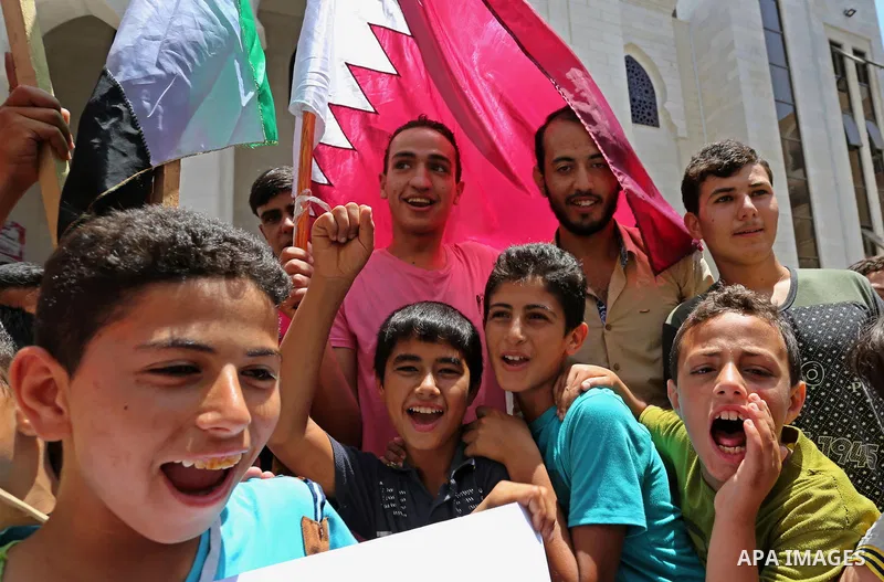 Palestinians take part in a rally in support of Qatar, inside Qatari-funded construction project 'Hamad City', in Khan Younis in the southern Gaza Strip, June 9, 2017. Photo by Ashraf Amra