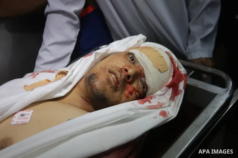 A relative mourns over the body of Palestinian Aaed Goma at a hospital morgue in the northern Gaza Strip June 9, 2017. Photo by Mohammed Asad