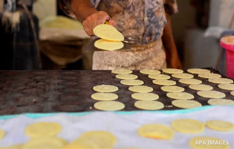 An Egyptian vendor prepares traditional pancakes known as ''Qatayef'' on the Muslim holy fasting month of Ramadan at market in Cairo, Egypt, on June 10, 2017. Ramadan is sacred to Muslims because it is during that month...