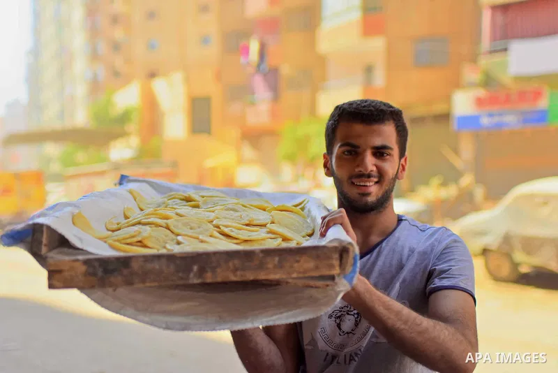 An Egyptian vendor prepares traditional pancakes known as ''Qatayef'' on the Muslim holy fasting month of Ramadan at market in Cairo, Egypt, on June 10, 2017. Ramadan is sacred to Muslims because it is during that month...