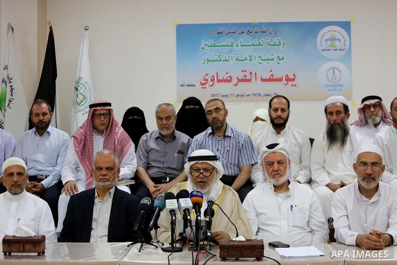 Marwan Abu Ras, a head of the Palestine Scholars Association, speaks during a press conference to show solidarity with Sheikh Yusuf al-Qaradawi in Gaza city on June 11, 2017. The Muslim World League announced the termina...