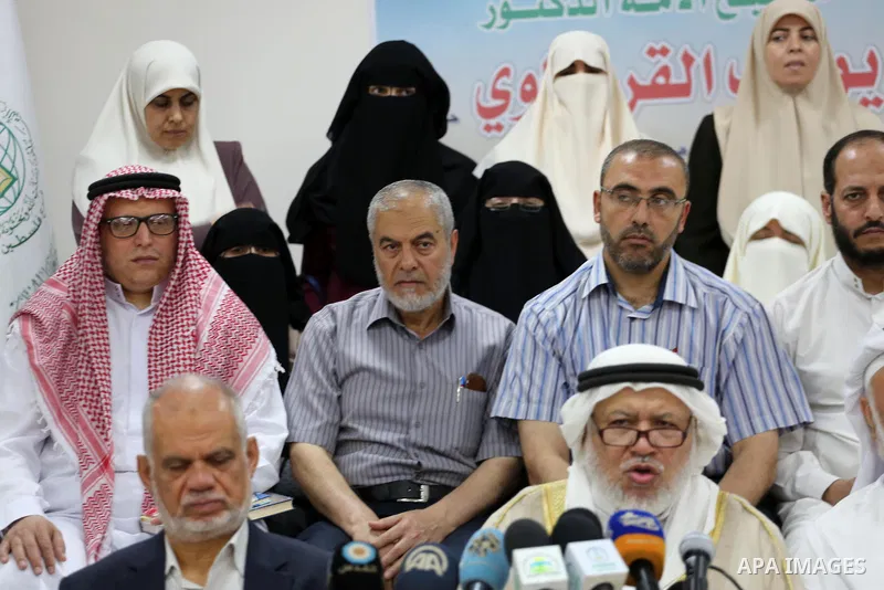 Marwan Abu Ras, a head of the Palestine Scholars Association, speaks during a press conference to show solidarity with Sheikh Yusuf al-Qaradawi in Gaza city on June 11, 2017. The Muslim World League announced the termina...