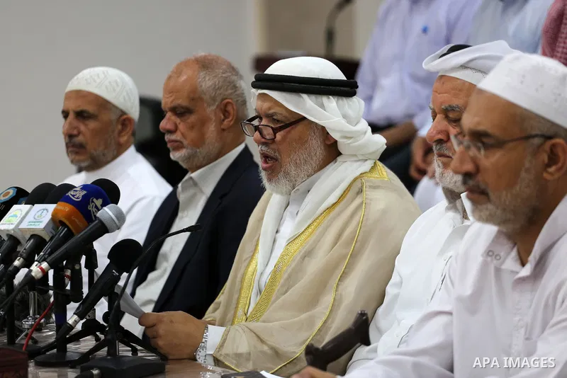 Marwan Abu Ras, a head of the Palestine Scholars Association, speaks during a press conference to show solidarity with Sheikh Yusuf al-Qaradawi in Gaza city on June 11, 2017. The Muslim World League announced the termina...