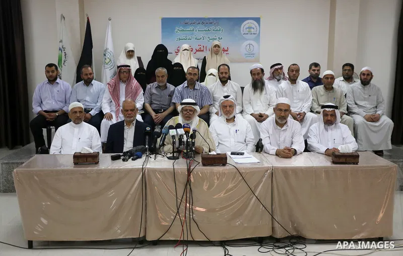 Marwan Abu Ras, a head of the Palestine Scholars Association, speaks during a press conference to show solidarity with Sheikh Yusuf al-Qaradawi in Gaza city on June 11, 2017. The Muslim World League announced the termina...