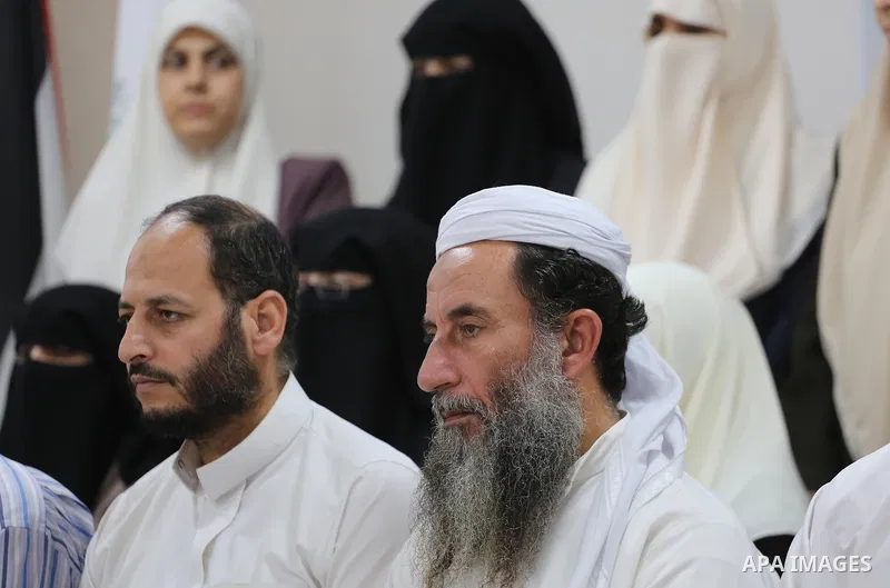 Members of Palestine Scholars Association attend a press conference to show solidarity with Sheikh Yusuf al-Qaradawi in Gaza city on June 11, 2017. The Muslim World League announced the termination of the membership of Y...