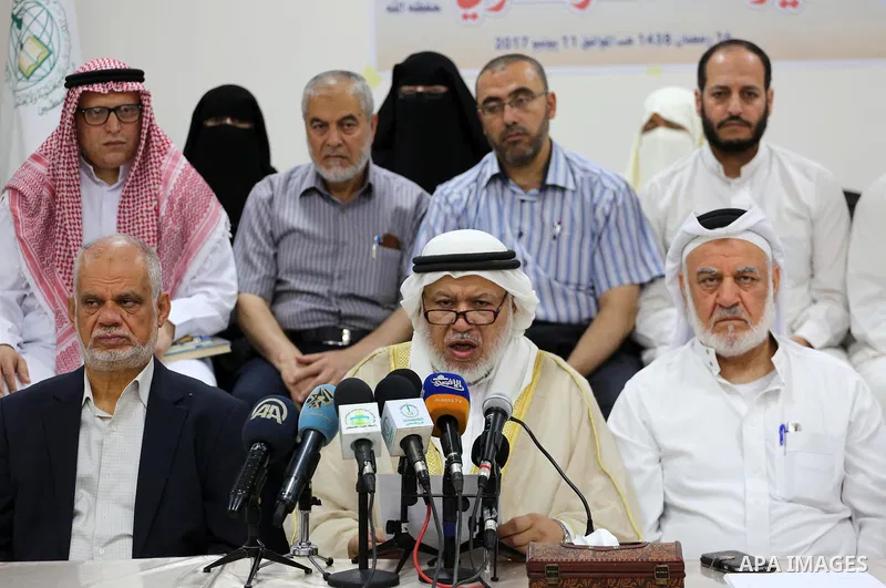 Marwan Abu Ras, a head of the Palestine Scholars Association, speaks during a press conference to show solidarity with Sheikh Yusuf al-Qaradawi in Gaza city on June 11, 2017. The Muslim World League announced the termina...
